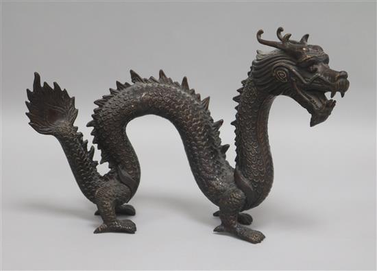 A 19th century Chinese bronze of a dragon Length 26cm. Height 17cm.